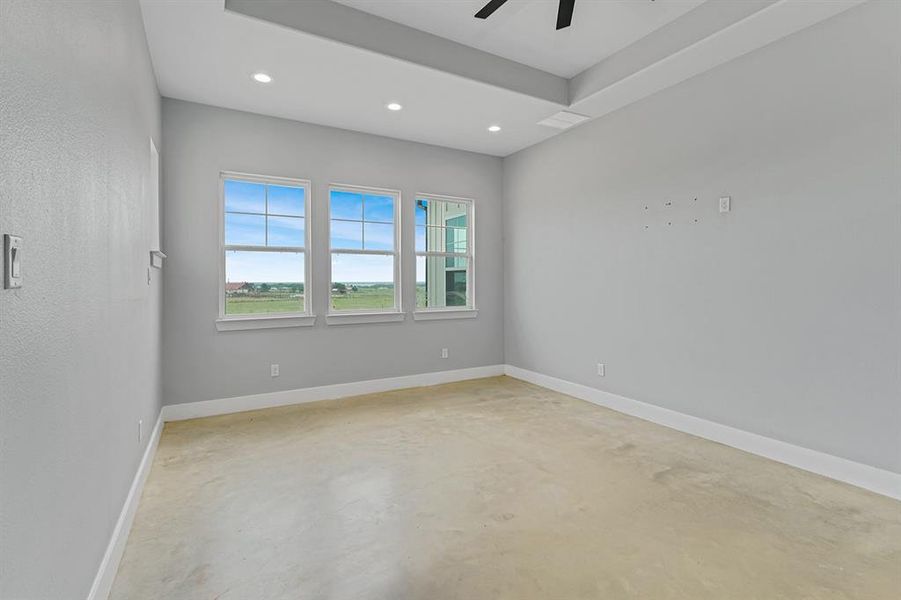 Unfurnished room featuring concrete floors, recessed lighting, a ceiling fan, and baseboards
