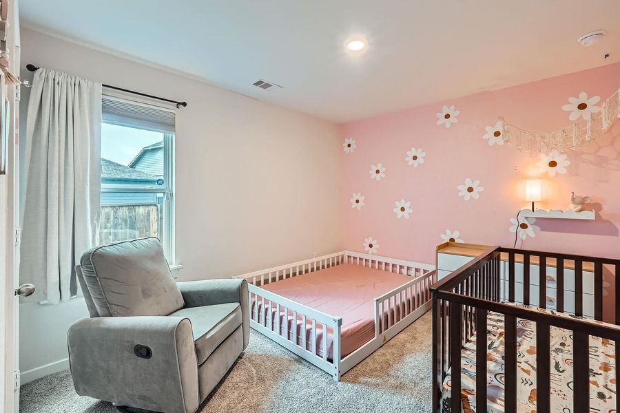 Bedroom featuring baseboards, carpet, and visible vents