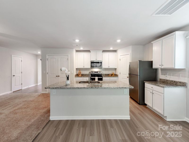 Furnished interior view inside a new home in McKee Creek Village, Charlotte (Image 11). Furnished interior view inside a new home in McKee Creek Village, Charlotte (Image 11).