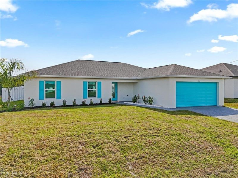 Front exterior of a new home in Cape Coral, Cape Coral, FL, highlighting curb appeal (Image 2).