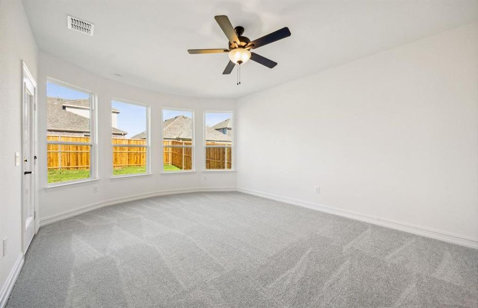 Elegant owner's suite with Bay window  *real home pictured