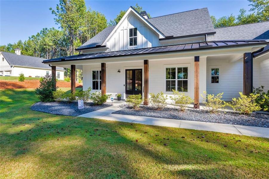 Front exterior of a new home in , Woodstock, GA, highlighting curb appeal (Image 20).