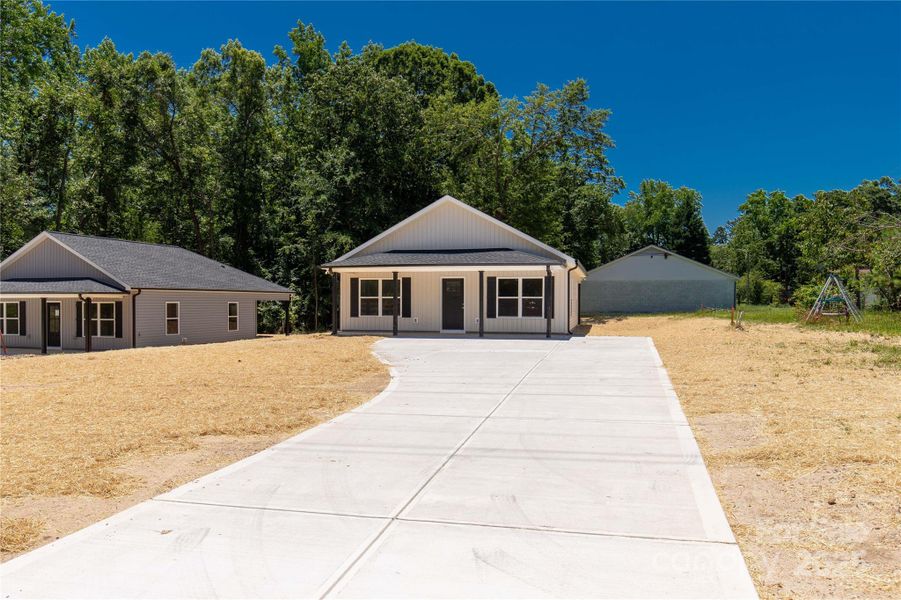 Front exterior of a new home in , Clover, SC, highlighting curb appeal (Image 2). Front exterior of a new home in , Clover, SC, highlighting curb appeal (Image 2).