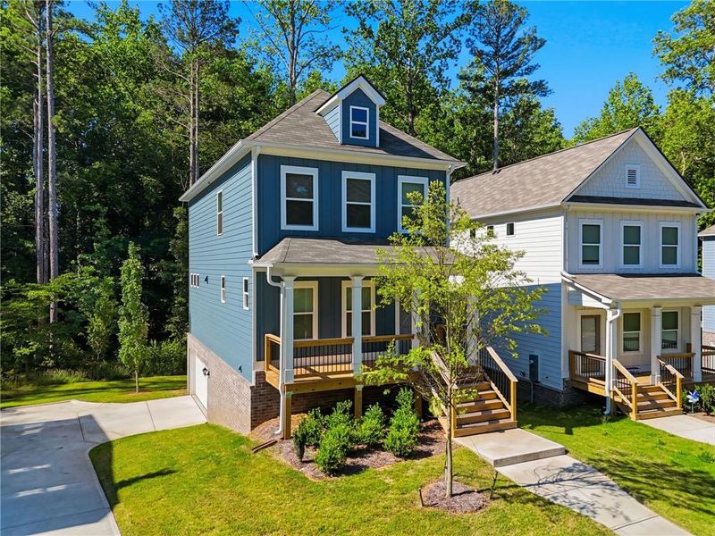 Front exterior of a new home in , Woodstock, GA, highlighting curb appeal (Image 28). Front exterior of a new home in , Woodstock, GA, highlighting curb appeal (Image 28).