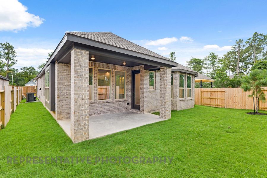 Front exterior of a new home in Evergreen, Conroe, TX, highlighting curb appeal (Image 17). Front exterior of a new home in Evergreen, Conroe, TX, highlighting curb appeal (Image 17).