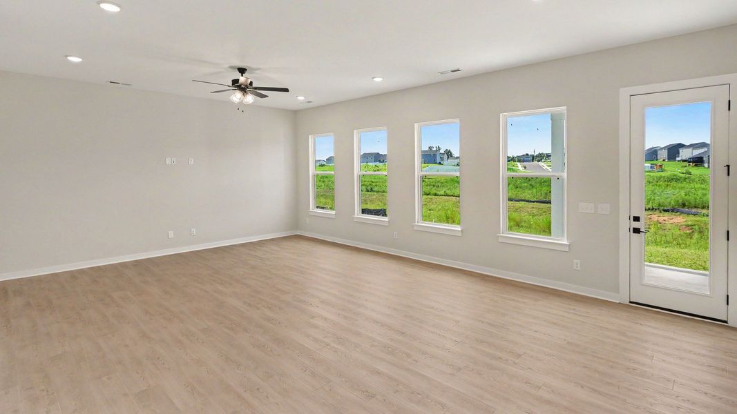 Living Room area with bright natural light and space for a dining table
