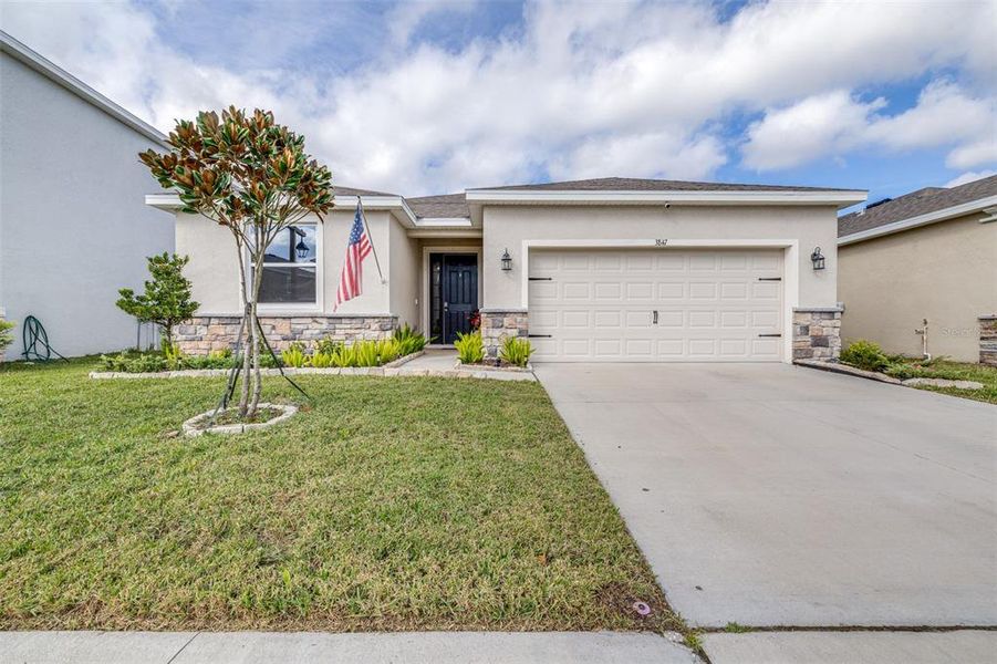 Front exterior of a new home in Farm at Varrea, Plant City, FL, highlighting curb appeal (Image 2).