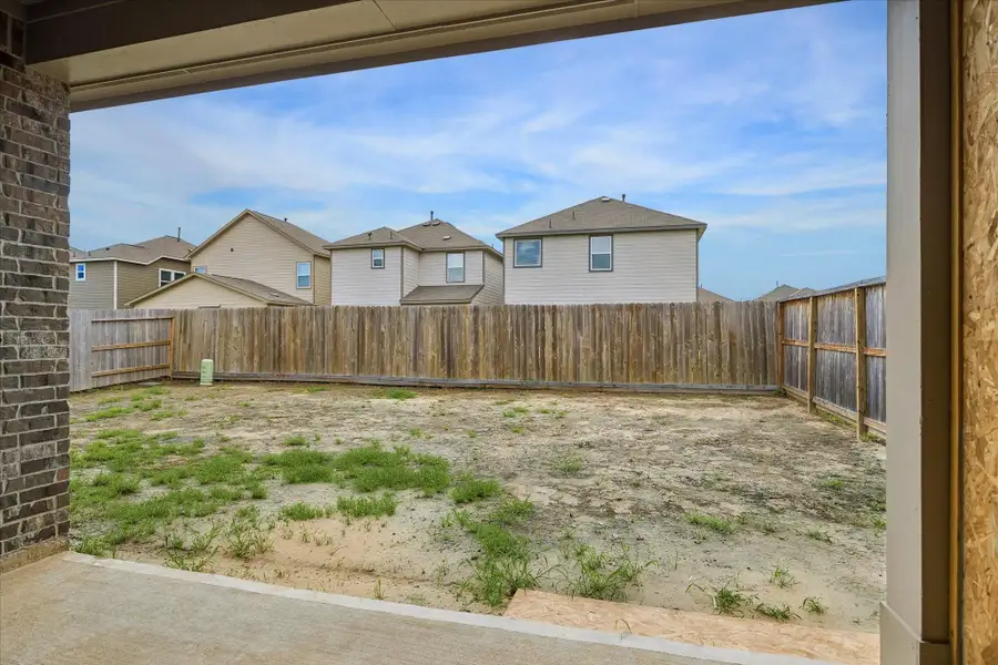 The oversized backyard offers a blank canvas for future landscaping, play space, gardening, or a custom outdoor retreat.