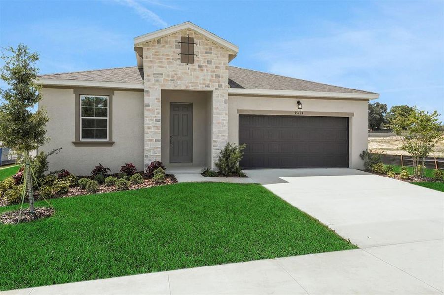 Front exterior of a new home in Tuscan Hills, Dade City, FL, highlighting curb appeal (Image 23).