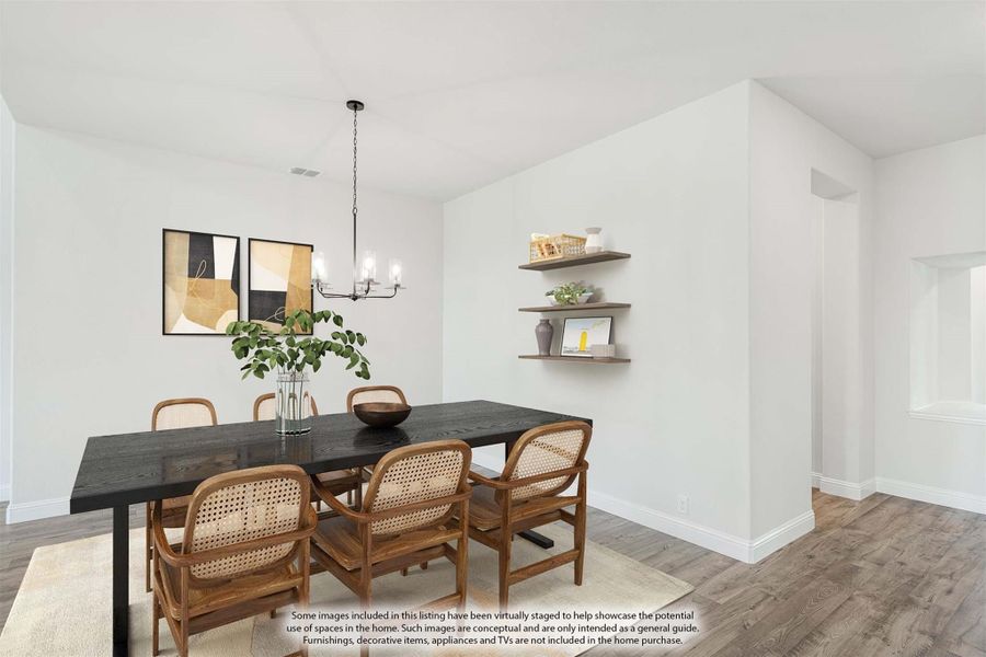 Dining room with dark wood table, rattan chairs, pendant light, and floating shelves on white walls