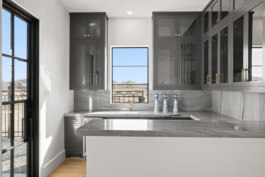 Wet bar attached to the first floor entertainers room.