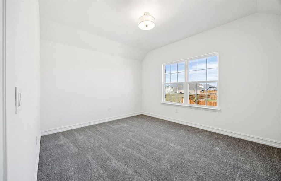 Comfortable bedroom with a bright window view Comfortable bedroom with a bright window view