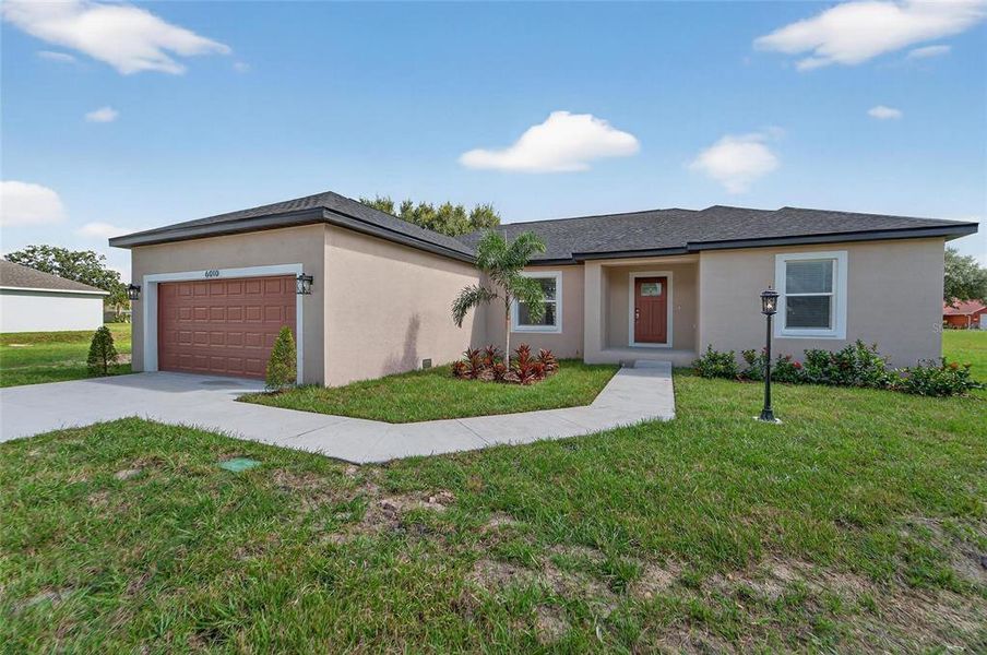 Front exterior of a new home in , Dade City, FL, highlighting curb appeal (Image 2). Front exterior of a new home in , Dade City, FL, highlighting curb appeal (Image 2).