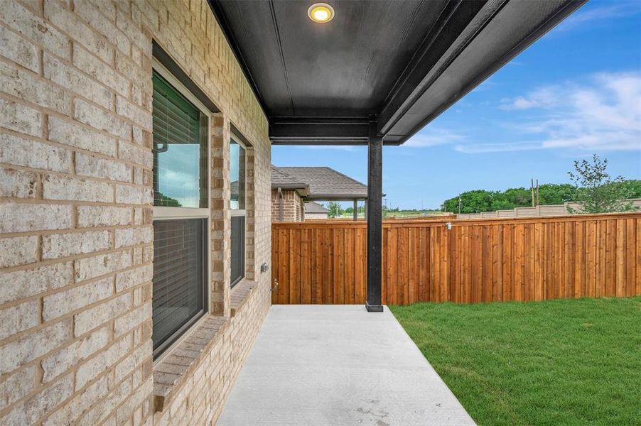 Exterior details and patio area of a home in Aspire at Reunion, Newark (Image 3).