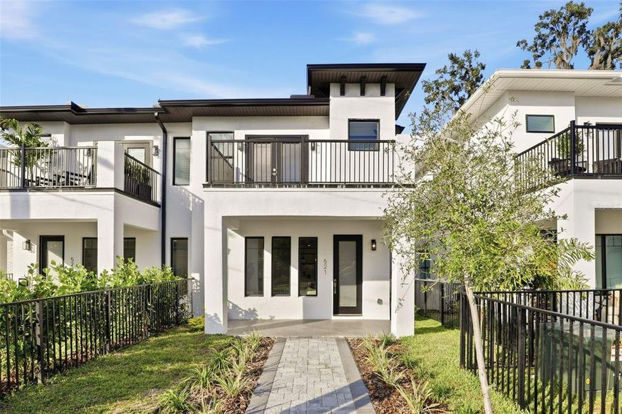 Front exterior of a new home in , Orlando, FL, highlighting curb appeal (Image 2).
