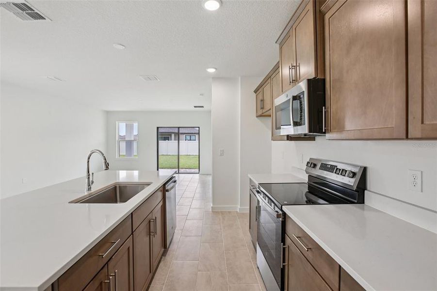 Furnished interior view inside a new home in Grasslands West, Lakeland (Image 13).