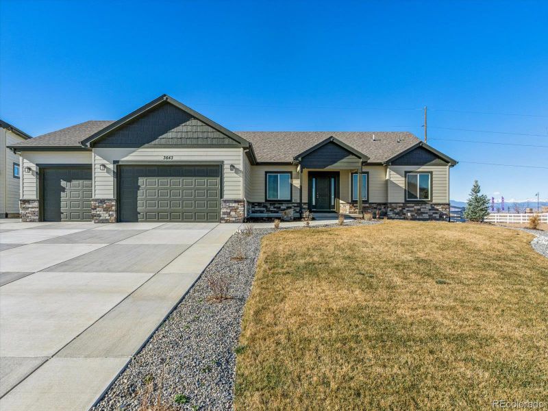 Front exterior of a new home in , Dacono, CO, highlighting curb appeal (Image 17).