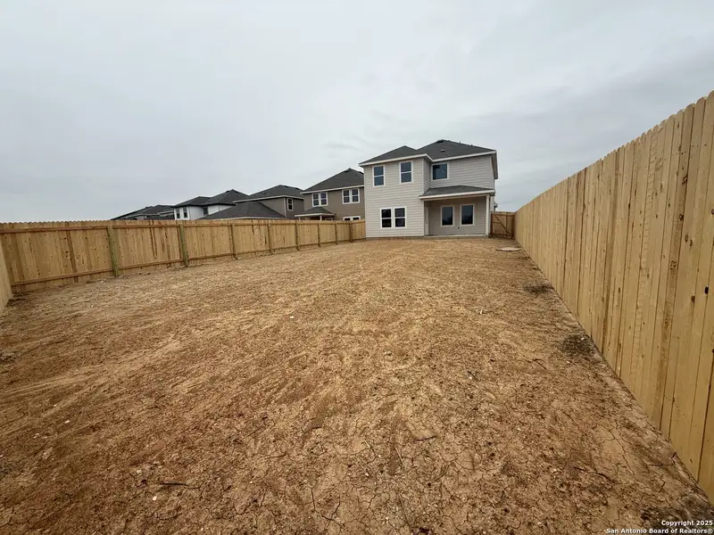 Exterior details and patio area of a home in Meadows at Hennersby Hollow 40's, San Antonio (Image 2).