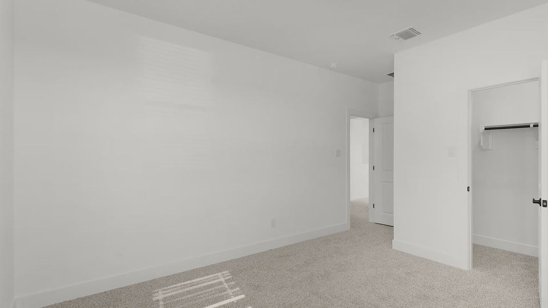 Representative unfurnished interior of a home built from the Cornell by Chesmar Homes in Crescent Bluff, Georgetown (Image 21).