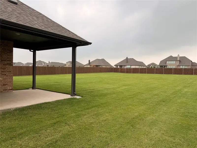 Exterior details and patio area of a home in Coyote Crossing, Godley (Image 3).