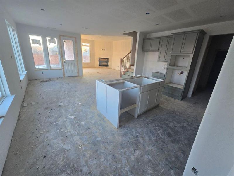 Kitchen featuring gray cabinets and a kitchen island