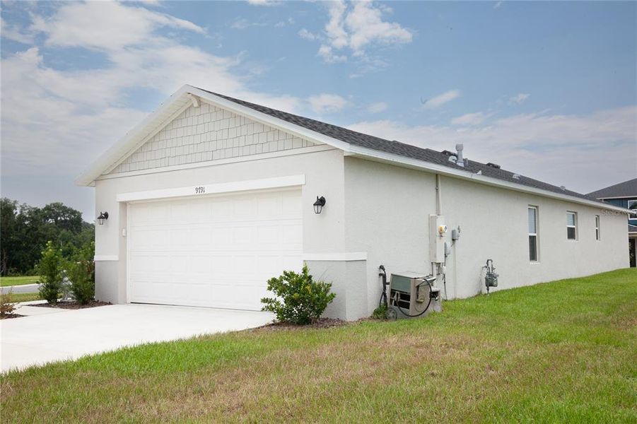 Front exterior of a new home in , Leesburg, FL, highlighting curb appeal (Image 27). Front exterior of a new home in , Leesburg, FL, highlighting curb appeal (Image 27).