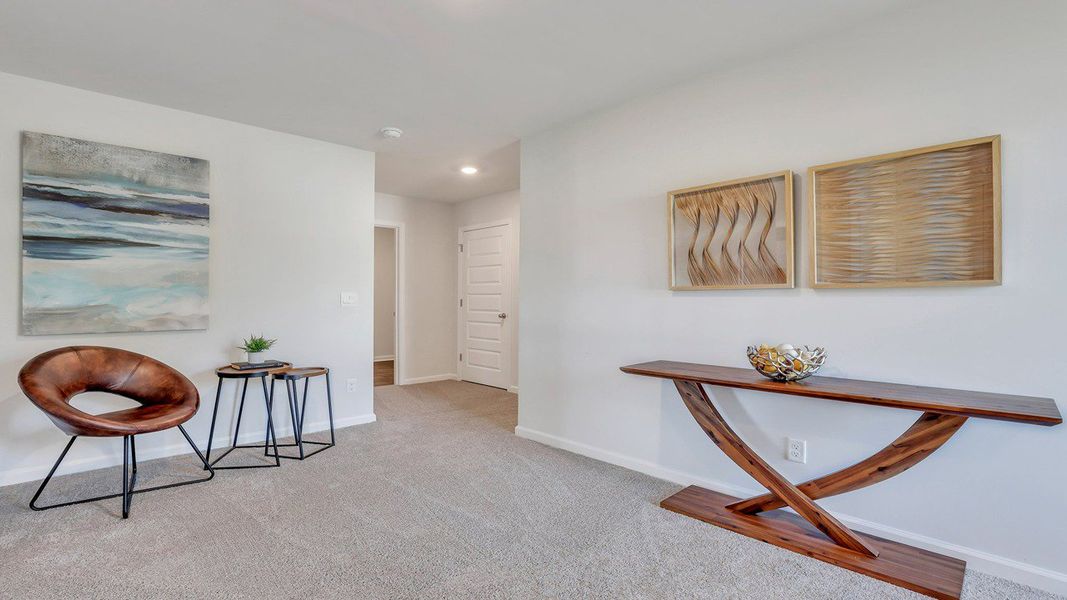 Representative furnished interior of a home built from the ROBIE by D.R. Horton in Longleaf Village, Rincon (Image 18).