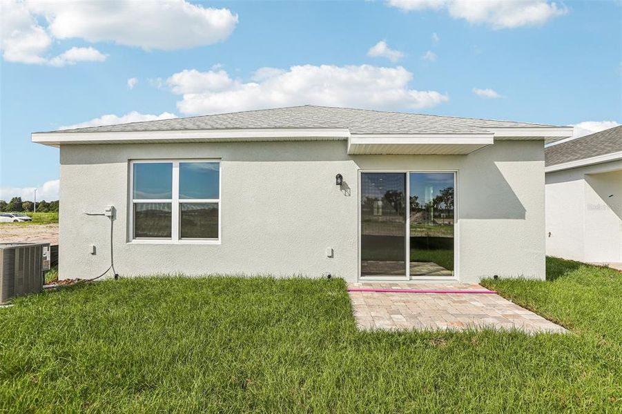 Front exterior of a new home in Willowbrook North, Winter Haven, FL, highlighting curb appeal (Image 17). Front exterior of a new home in Willowbrook North, Winter Haven, FL, highlighting curb appeal (Image 17).