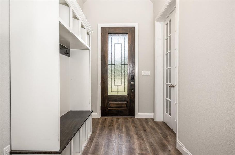 Mudroom with dark wood-type flooring