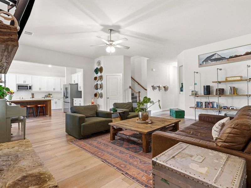 Spacious living area flowing seamlessly into kitchen and dining spaces for functional open layout.