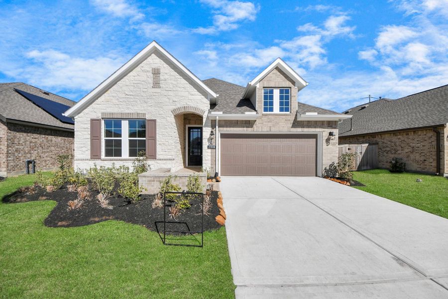 Front exterior of a new home in Bridgeland: Heritage Collection, Cypress, TX, highlighting curb appeal (Image 2). Front exterior of a new home in Bridgeland: Heritage Collection, Cypress, TX, highlighting curb appeal (Image 2).