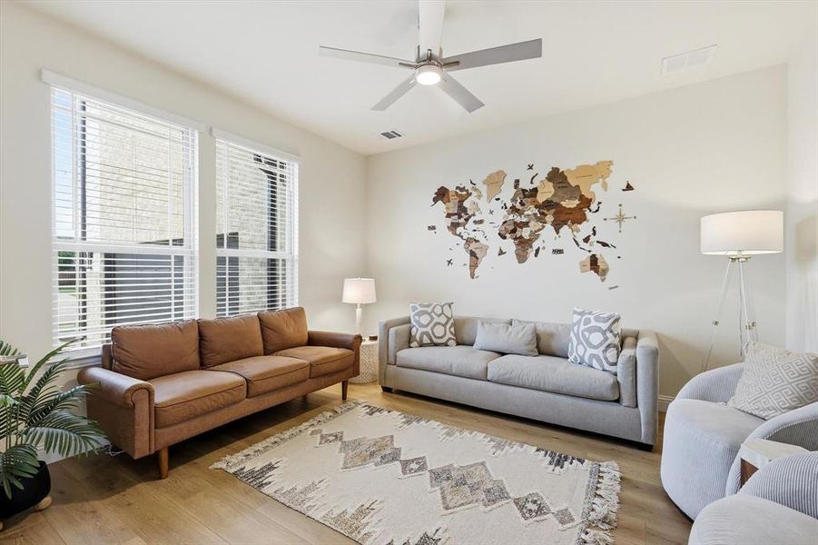 Spacious office room with a designers ceiling fan