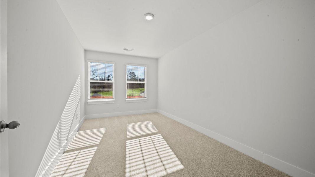 Refined bedroom design with large windows for daylight-filled mornings and peaceful views
