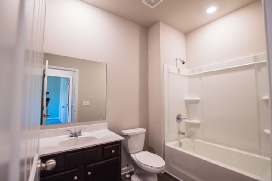 Representative furnished interior of a home built from the Cadence Unit A by Piedmont Residential in Ross Pointe, Kennesaw (Image 9).