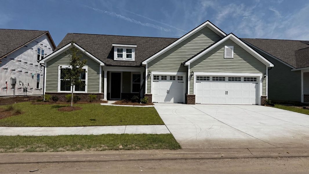 Front exterior of a new home in Crescent Cove, Myrtle Beach, SC, highlighting curb appeal (Image 19).