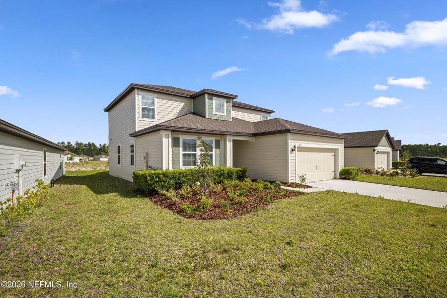 Front exterior of a new home in Westport Landing, Jacksonville, FL, highlighting curb appeal (Image 23).