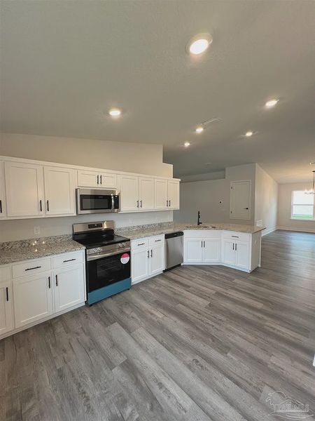Furnished interior view inside a new home in Pine Top, Cantonment (Image 4).