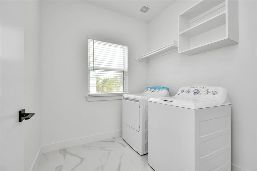 Spacious dedicated laundry area with plenty of room for large washer and dryer, ensuring that even the everyday household chores are completed in elegance with ease and efficiency