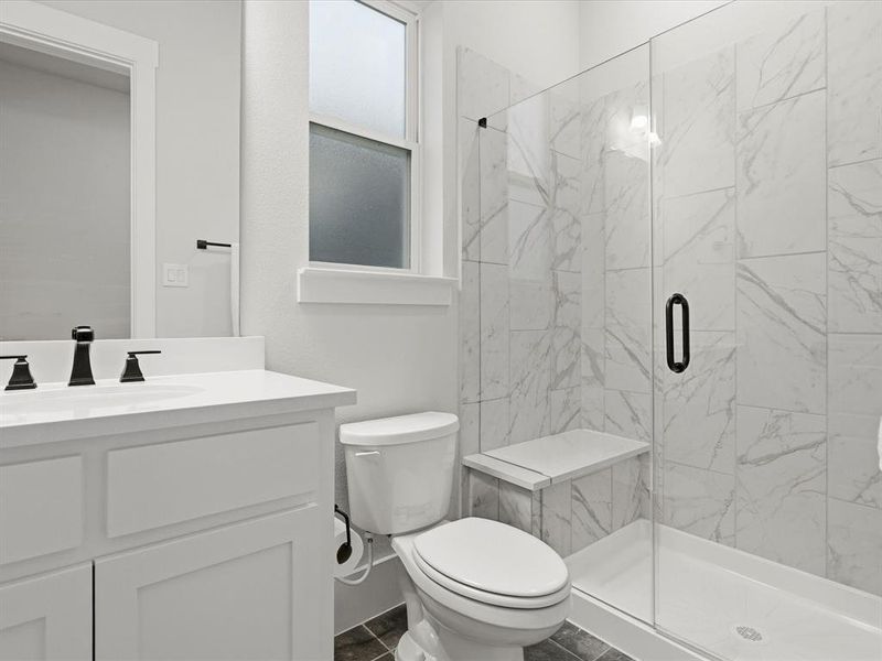 Contemporary bathroom featuring a frameless glass shower enclosure with marble-look tile, a built-in shower bench, and a white vanity with a rectangular sink Contemporary bathroom featuring a frameless glass shower enclosure with marble-look tile, a built-in shower bench, and a white vanity with a rectangular sink