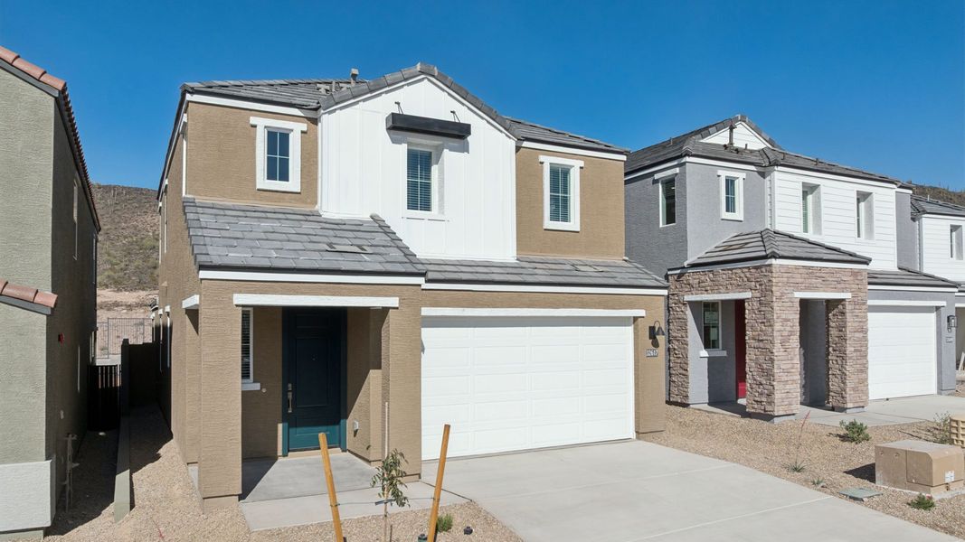 Front exterior of a new home in The Buttes at Mystic, Peoria, AZ, highlighting curb appeal (Image 2). Front exterior of a new home in The Buttes at Mystic, Peoria, AZ, highlighting curb appeal (Image 2).