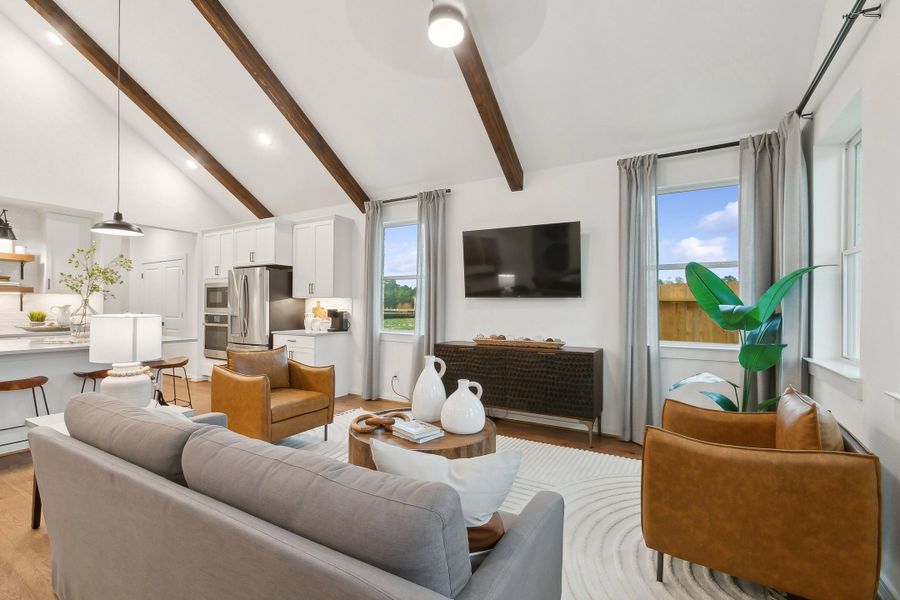 Great room with vaulted ceiling and stained ceiling beams Great room with vaulted ceiling and stained ceiling beams