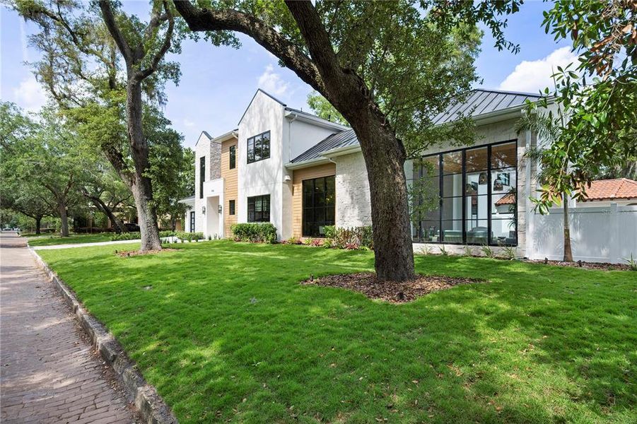 Front exterior of a new home in , Winter Park, FL, highlighting curb appeal (Image 23).