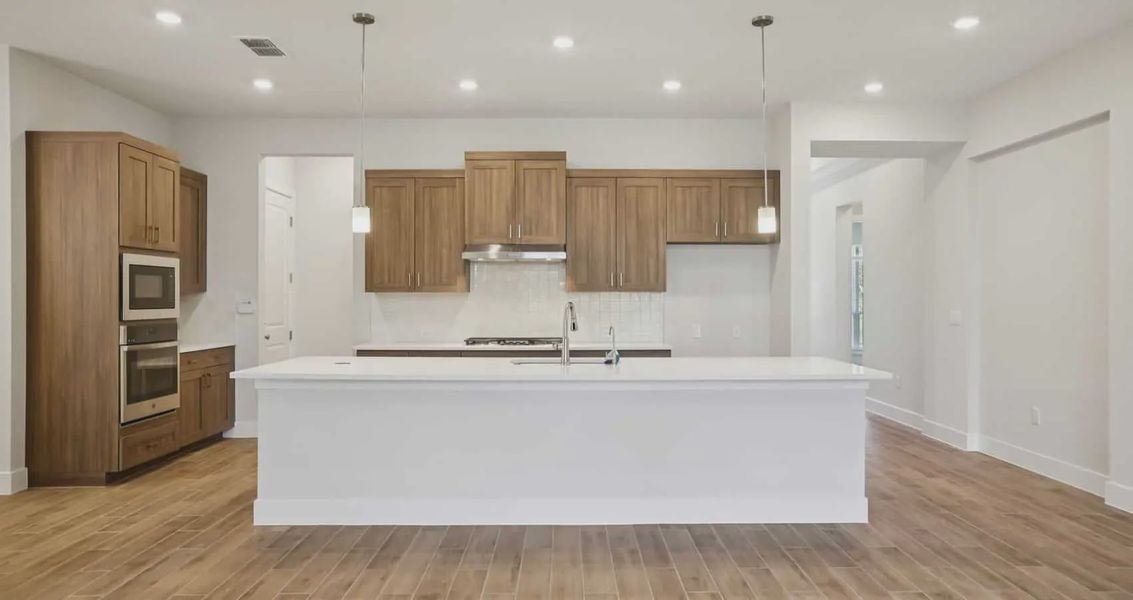 Furnished interior view inside a new home in 6 Creeks, Kyle (Image 5).