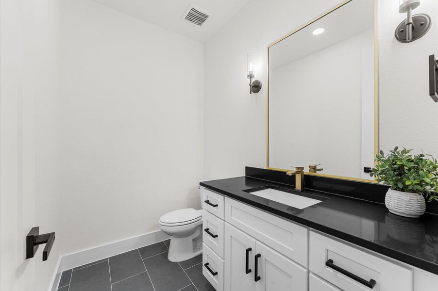 Half bathroom downstairs. Half bathroom downstairs.