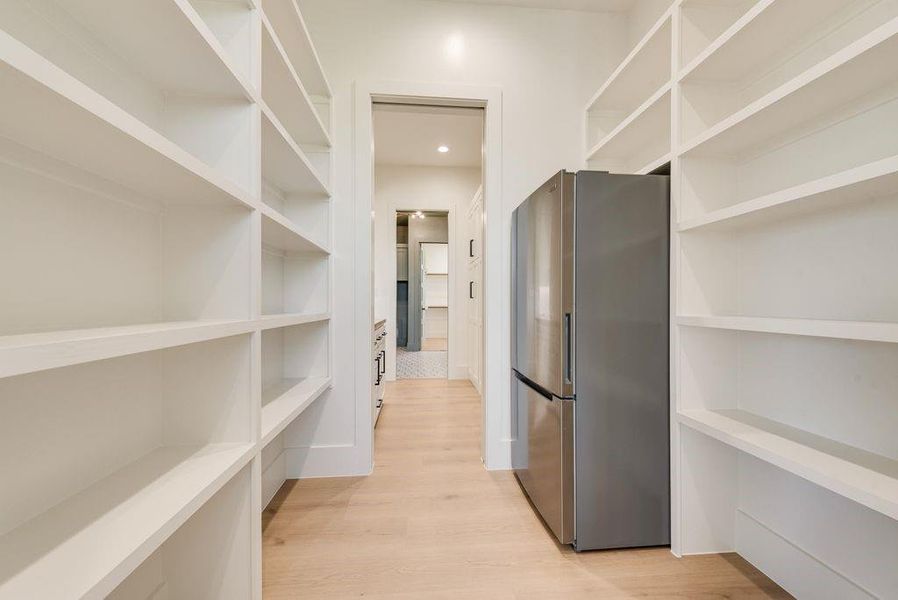 walk in pantry with pocket door, extra fridge