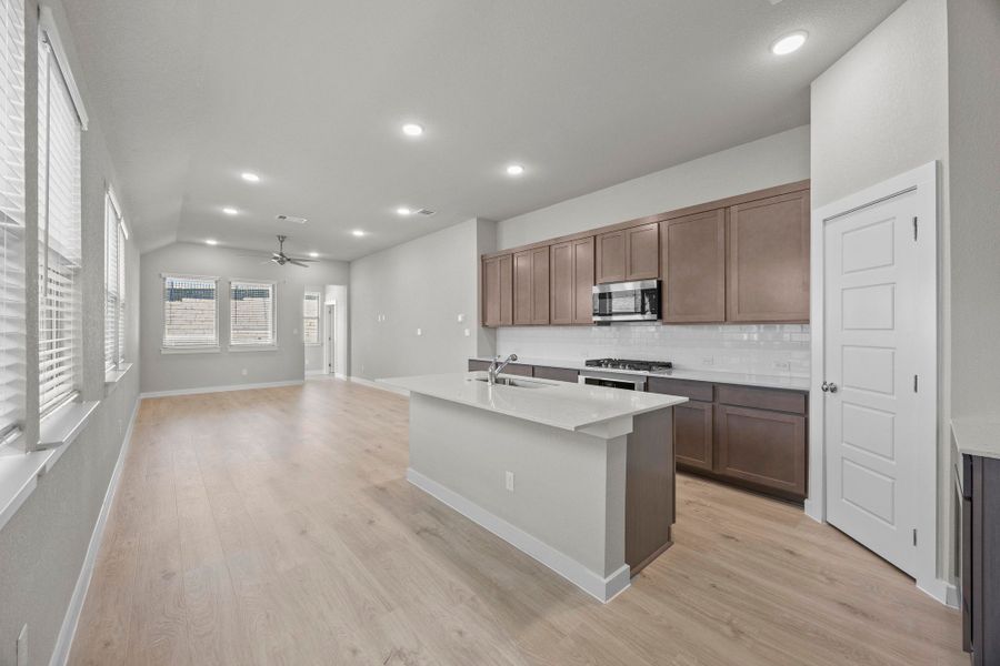 Kitchen in the Cedar home plan by Trophy Signature Homes – REPRESENTATIVE PHOTO