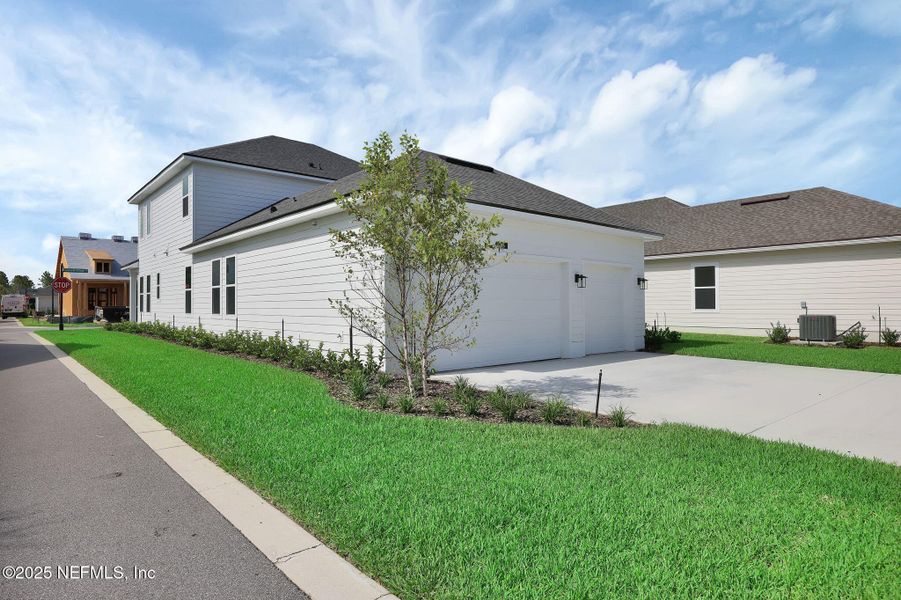 Front exterior of a new home in Seabrook Village at Seabrook, Nocatee, FL, highlighting curb appeal (Image 26). Front exterior of a new home in Seabrook Village at Seabrook, Nocatee, FL, highlighting curb appeal (Image 26).