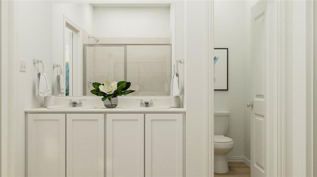 Bathroom with vanity, a shower with shower door, toilet, and hardwood / wood-style flooring