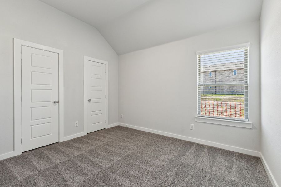 Bedroom in the Amber home plan by Trophy Signature Homes – REPRESENTATIVE PHOTO