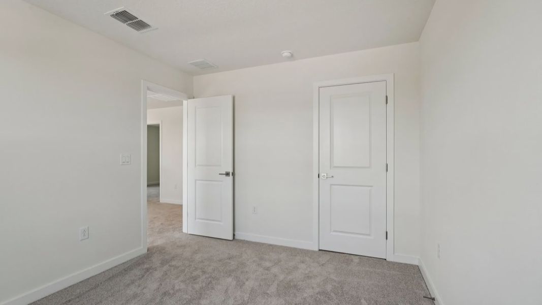 Secondary Bedroom located in the Jupiter in Hamilton Bluff located in Haines City, FL.